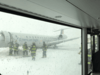 Chicago Fire Department on scene after a plane skidded off runway at O’ Hare. (Credit: Luis Torres Curet)