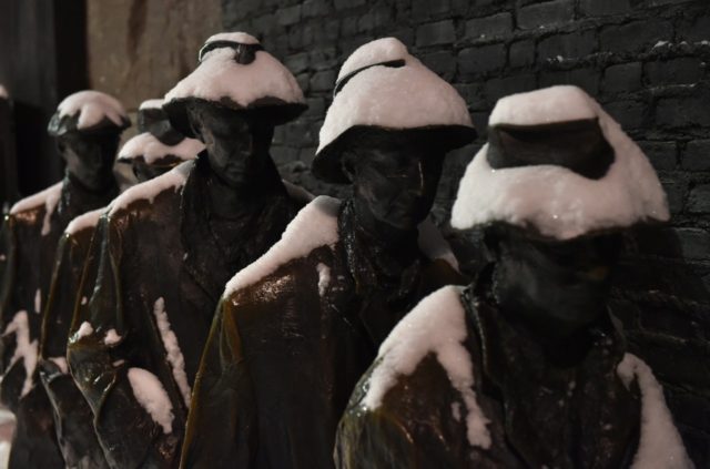 Snow covers the "The breadline" sculpture at the Franklin D. Roosevelt memorial