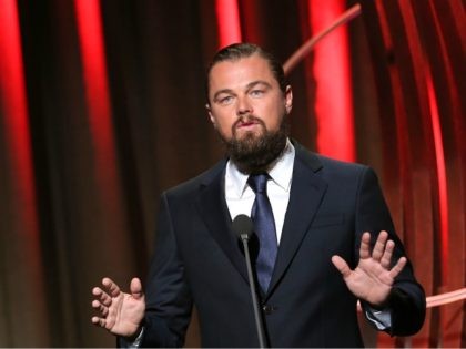 NEW YORK, NY - SEPTEMBER 21: Actor/activist Leonardo DiCaprio (R) accepts the Clinton Glob