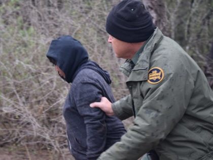 McAllen Station Border Patrol agent apprehends migrant woman left in the near freezing wet brush for 12 hours. (File Photo: Bob Price/Breitbart Texas)