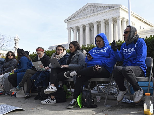 People wait in line outside the Supreme Court in Washington, Monday, Nov. 11, 2019, to be able to attend oral arguments in the case of President Trump's decision to end the Obama-era, Deferred Action for Childhood Arrivals program (DACA). (AP Photo/Susan Walsh)