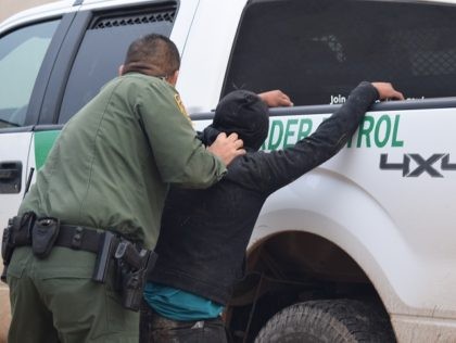 A McAllen Station Border Patrol agent arrests a migrant who illegally crossed the border from Mexico into Texas. (File Photo: Bob Price/Breitbart Texas)