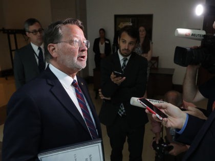 WASHINGTON, DC - JUNE 05: Sen. Gary Peters (D-MI) talks with journalists after meeting with General Motors CEO Mary Barra and fellow lawmakers from Michigan at the U.S. Capitol June 05, 2019 in Washington, DC. Barra was meeting with lawmakers to discuss President Donald Trump's Mexican tariff threats and the …