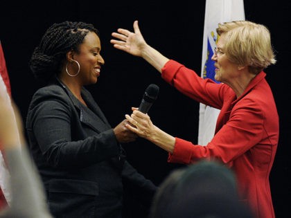 Massachusetts Democratic congressional candidate Ayanna Pressley (L) greets US Senator Elizabeth Warren (D-MA) during a town hall meeting in Roxbury, Massachusetts, October 13, 2018. (Photo by Joseph PREZIOSO / AFP) (Photo credit should read JOSEPH PREZIOSO/AFP via Getty Images)