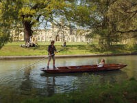CAMBRIDGE, UNITED KINGDOM - APRIL 19: Members of the public punt along the river Cam in front of the colleges of Cambridge University on April 19, 2011 in Cambridge, England. The UK is currently basking in fine weather with the Met Office predicting temperatures up to 25C this week. The …