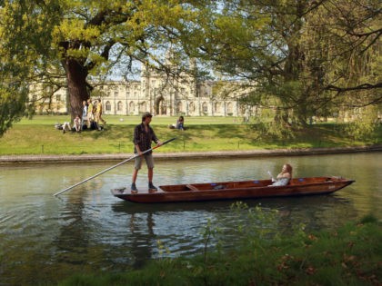 CAMBRIDGE, UNITED KINGDOM - APRIL 19: Members of the public punt along the river Cam in front of the colleges of Cambridge University on April 19, 2011 in Cambridge, England. The UK is currently basking in fine weather with the Met Office predicting temperatures up to 25C this week. The …