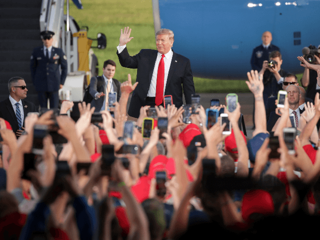 U.S. President Donald Trump waves to the crowd as he arrives for a 'Make America Great Aga
