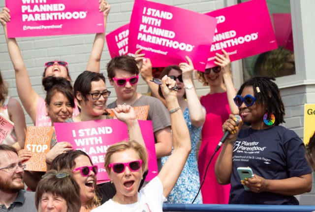 Kawanna Shannon(R), director of surgical services for Planned Parenthood in St. Louis, speaks alongside pro-choice supporters as they hold a rally outside the Planned Parenthood Reproductive Health Services Center in St. Louis, Missouri, May 31, 2019, the last location in the state performing abortions. - A US Court on May …