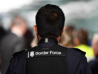 A member UK Border Force patrols at Heathrow Airport in London on July 16, 2019, part of Operation Limelight, a national multi-agency safeguarding operation at the UK border that focuses on harmful practices. - In collaboration with Border Force, specialist officers from the Met's Continuous Policing Improvement Command will be …