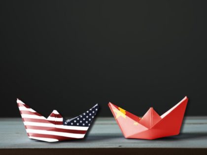 USA flag and China flag print screen on ship with black background.It is symbol of tariff trade war tax barrier between United States of America and China.-Image.