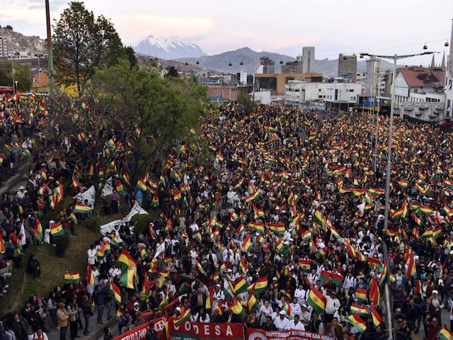 People take part in an open forum summoned by the National Committee in Defense of Democracy (CONADE) on the second week of civic strike against the results of the October 20 election in La Paz on October 31, 2019. - A mission of the Organization of American States (OAS) began its audit of the disputed Bolivian presidential election that resulted in a fourth term for President Evo Morales, but sparked deadly riots. (Photo by AIZAR RALDES / AFP) (Photo by AIZAR RALDES/AFP via Getty Images)