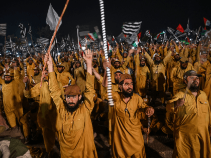 Supporters of Islamic political party Jamiat Ulema-e-Islam (JUI-F) react as they listen to