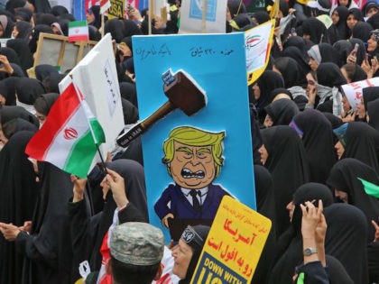 A picture taken on November 4, 2019, shows a placard mocking US president donald Trump dur