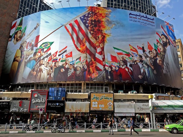 A new giant billboard, designed to to mark the 40th anniversary of the Iran hostage crisis, covers the facade of a building in the Iranian capital Tehran, on November 4, 2019. - On November 4, 1979, less than nine months after the toppling of Iran's American-backed shah, students overran the …