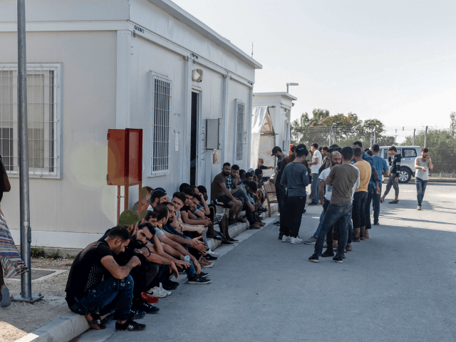 Syrian refugees rest inside the Temporary Accommodation Centre in Kokkinotrimithia, some 2