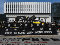 Students in Guy Fawkes masks march before the congregation ceremony at the Chinese University of Hong Kong on November 07, 2019 in Hong Kong, China. As Hong Kong braces for a series of protests over the weekend and on the 70th anniversary of the founding of the Peoples Republic of …