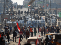 Iraqi security forces confront demonstrators on Martyrs' Bridge (Jisr Al-Shuhada) in the capital Baghdad on November 7, 2019, amid ongoing anti-government protests. (Photo by AHMAD AL-RUBAYE / AFP) (Photo by AHMAD AL-RUBAYE/AFP via Getty Images)
