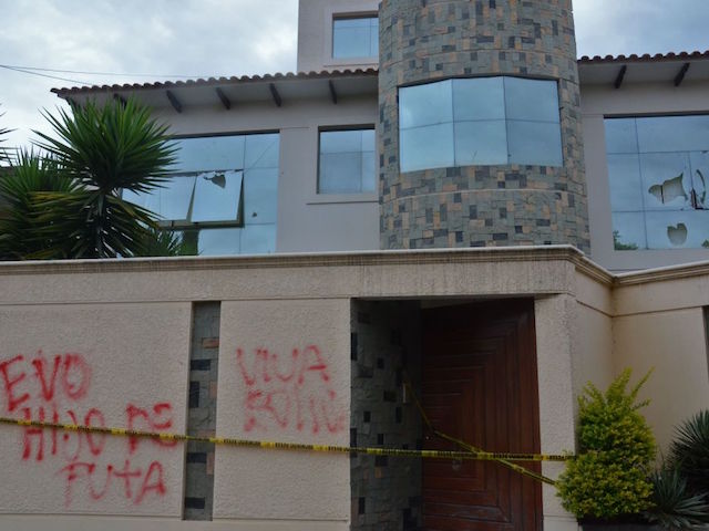 EDITORS NOTE: Graphic content / View of Bolivian ex-President Evo Morales's home facade with a broken window and a graffiti reading "Evo son of a bitch" and "Long live Bolivia" in Cochabamba, Bolivia, on November 11, 2019. - Bolivian President Evo Morales has resigned, caving in after three weeks of sometimes violent protests over his disputed re-election, as his allies denounce an alleged coup. (Photo by STR / AFP) (Photo by STR/AFP via Getty Images)