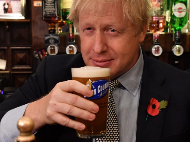 WOLVERHAMPTON, UNITED KINGDOM - NOVEMBER 11: British Prime Minister Boris Johnson sips a p