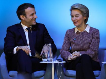 European Commission president Ursula von der Leyen (R) speaks to French President Emmanuel