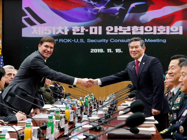 US Defense Secretary Mark Esper (L) shakes hands with South Korean Defence Minister Jeong