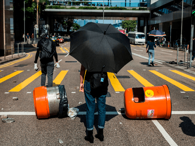 Pro-democracy protesters block a road during a demonstration in Central in Hong Kong on No