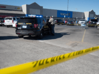 A police officer maintains a security line after a shooting in a Walmart parking lot on November 18, 2019 in Duncan, Oklahoma. A gunman killed two people in a car in the parking lot outside an Oklahoma Walmart before fatally shooting himself. (Photo by J Pat Carter/Getty Images)