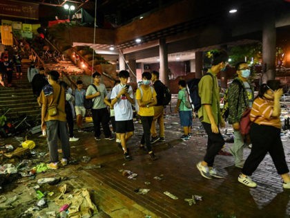 Some protesters under the age of 18 leave from the Hong Kong Polytechnic University in the