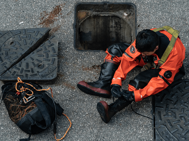 ire Services Department rescue diver prepares to enter the sewage system to search for protesters who escape from The Hong Kong Polytechnic University on November 20, 2019 in Hong Kong, China. Anti-government protesters organized a general strike since Monday as demonstrations in Hong Kong stretched into its sixth month with …