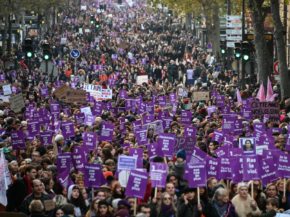 TOPSHOT - People take part in a protest to condemn violence against women, on November 23,