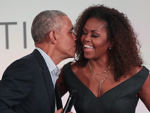 CHICAGO, ILLINOIS - OCTOBER 29: Former U.S. President Barack Obama gives his wife Michelle a kiss as they close the Obama Foundation Summit together on the campus of the Illinois Institute of Technology on October 29, 2019 in Chicago, Illinois. The Summit is an annual event hosted by the Obama …