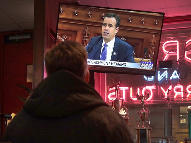 CHICAGO, ILLINOIS - NOVEMBER 13: Live testimony of the House impeachment hearings against President Donald Trump is shown on a television at the Billy Goat Tavern on November 13, 2019 in Chicago, Illinois. In the first public impeachment hearings in more than two decades, House Democrats are making a case …
