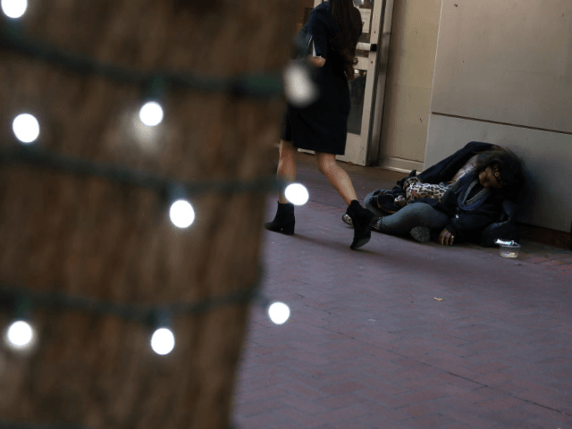A homeless woman sleeps on the sidewalk on November 25, 2019 in San Francisco, California. The Trump administration could be preparing to replace recently dismissed executive director of the U.S. Interagency Council on Homelessness Matthew Doherty and deliver a new agenda to combat homelessness in cities like San Francisco and …