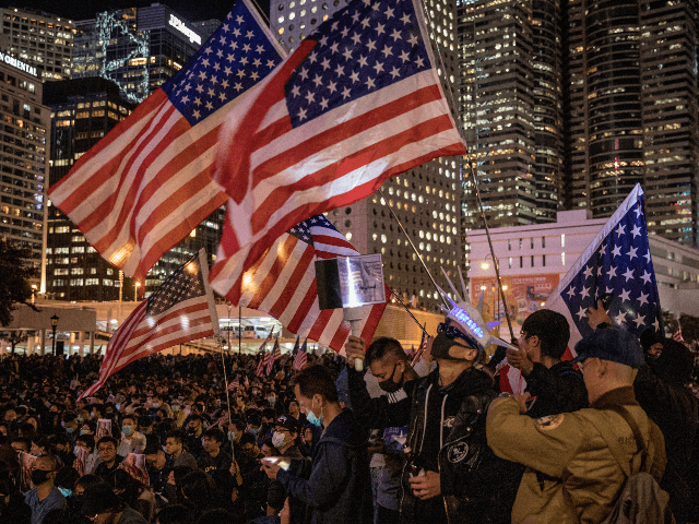Pro-democracy protesters take part in a Thanksgiving Day rally at Edinburgh Place on November 28, 2019 in Hong Kong, China. Protesters gathered to say thank you to the United States after US President Donald Trump signed legislation supporting the Hong Kong pro-democracy protesters, with new legislation requiring annual reviews of …