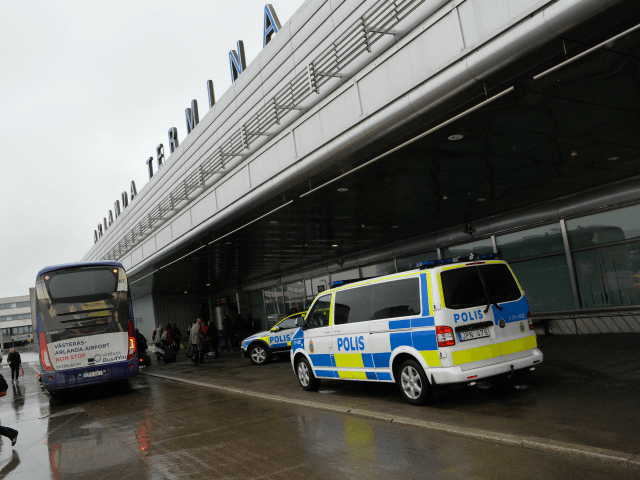 A police bus is parked by the entrance to Arlanda airport, outside Stockholm, on March 22,