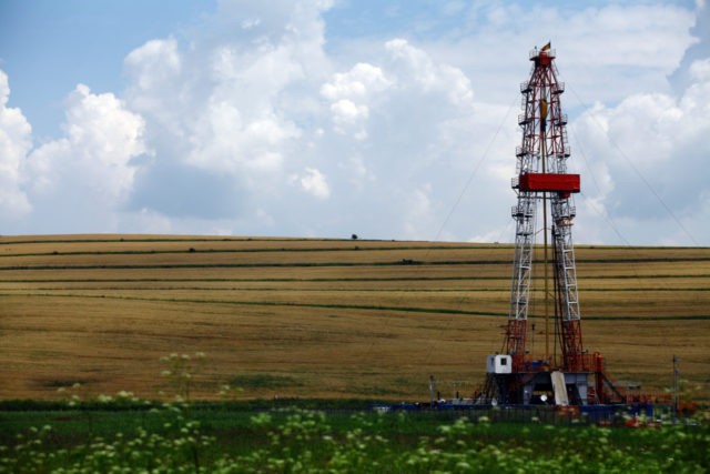 Color shot of a shale gas drilling rig on a field.