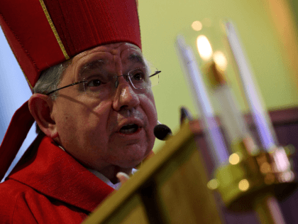 Archbishop Jose Gomez celebrates a special Spanish language Mass for the Day of the Holy Cross, which honors the contributions of migrant construction workers and laborers at the Our Lady Queen of Angels Parish in Los Angeles, California on May 3, 2017. / AFP PHOTO / Mark RALSTON (Photo credit …