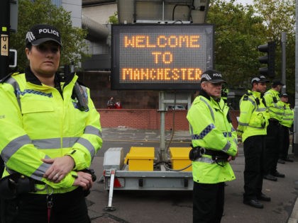 MANCHESTER, ENGLAND - OCTOBER 01: Police stand guard as anti-Brexit and anti-austerity ac