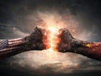 Conflict, close up of two fists hitting each other over dramatic background with copy space