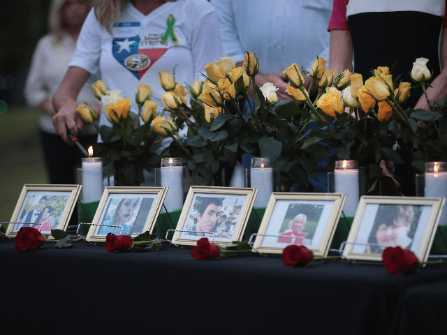 Candles are lit at a prayer vigil to remember the victims from the Santa Fe High School shooting at Walter Hall Park on May 20, 2018 in League City, Texas. Last Friday, 17-year-old student Dimitrios Pagourtzis entered the school with a shotgun and a pistol and opened fire, killing 10 …