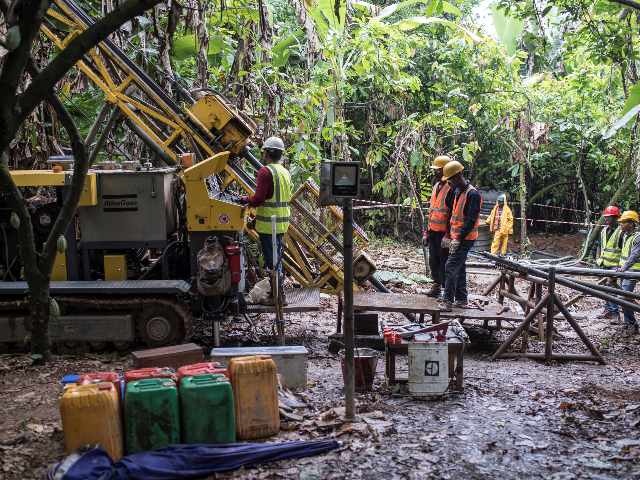 A mineral exploration drilling team drills holes to identify the location and the quality