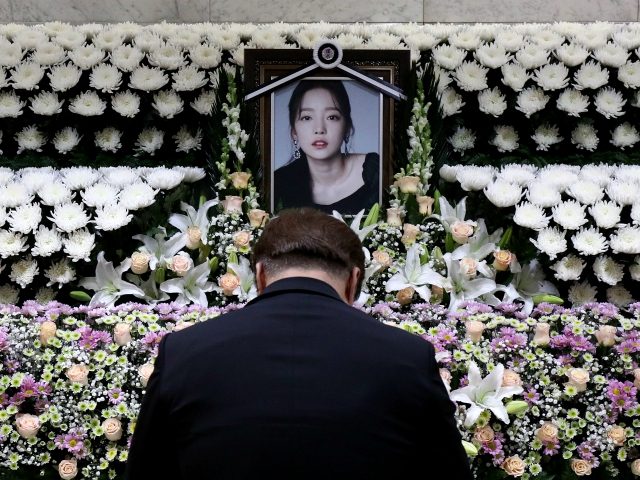 SEOUL, SOUTH KOREA - NOVEMBER 25: A South Korean man pays tribute at a memorial altar as his makes a call of condolence in honor of the K-pop star Goo Hara at the Seoul St. Mary's Hospital on November 25, 2019 in Seoul, South Korea. K-pop star Goo Hara of …
