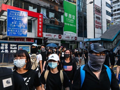 HONG KONG, CHINA - NOVEMBER 2: Protestors march on the street in Causeway bay on November 2, 2019 in Hong Kong, China. Hong Kong slipped into a technical recession on Thursday after anti-government demonstrations stretched into its fifth month while protesters continue to call for Hong Kong's Chief Executive Carrie …