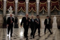 WASHINGTON, DC - FEBRUARY 27: House Majority Whip Rep. Steve Scalise (R-LA), second from left, walks with Deputy Whip Rep. Patrick McHenry (R-NC), at center, on their way to the House chamber to vote on a stopgap spending bill to fund the Department of Homeland Security at the U.S. Capitol …