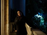 In this Monday, Nov. 11, 2019 photo, human rights lawyer Hoda Nasrallah poses for a portrait at her office in Cairo, Egypt. Since her father's death last year, Huda Nasrallah, a Christian, has stood before three different judges to demand an equal share of the property left to her two …