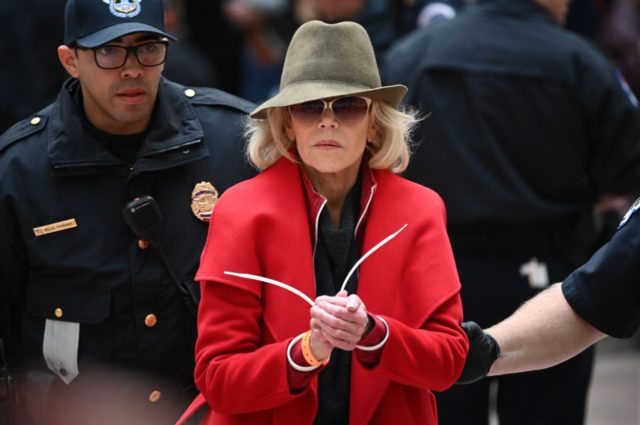 TOPSHOT - Actress and activist Jane Fonda is arrested by Capitol Police during a climate protest inside the Hart Senate office building on November 1, 2019 in Washington, DC. (Photo by Mandel NGAN / AFP) (Photo by MANDEL NGAN/AFP via Getty Images)