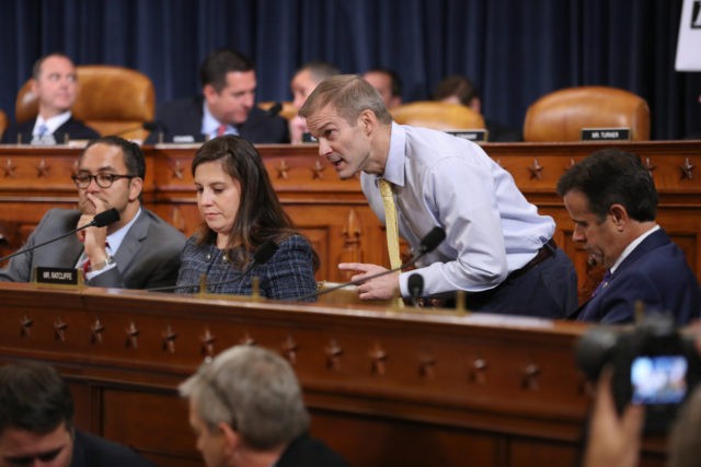 WASHINGTON, DC - NOVEMBER 13: Newly added House Intelligence Committee member Rep. Jim Jordan (R-OH) (3rd L) works to coordinate fellow committee Republicans (L-R) Rep. Will Hurd (R-TX), Rep. Elise Stefanik (R-NY) and Rep. John Ratcliffe (R-TX) during the first day of public hearing in the impeachment inquiry in the …