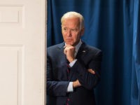 ROCHESTER, NH - OCTOBER 09: Democratic presidential candidate, former Vice President Joe Biden peeks out from backstage during a campaign event on October 9, 2019 in Rochester, New Hampshire. For the first time, Biden has publicly called for President Trump to be impeached. (Photo by Scott Eisen/Getty Images)