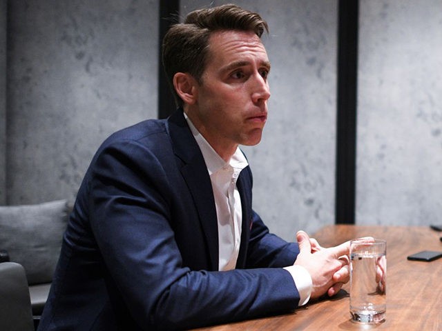 US Republican Senator from Missouri Josh Hawley listens to questions from members of the media at a hotel in Hong Kong on October 14, 2019. - Strife-torn Hong Kong is sliding towards a police state, US senator Josh Hawley warned on October 14, as the financial hub braces for a …