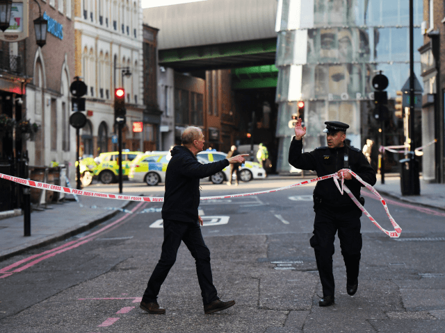 LONDON, ENGLAND - NOVEMBER 29: Members of the public are held behind a police cordon near London Bridge train station after reports of shots being fired on London Bridge on November 29, 2019 in London, England. Police responded to an incident around 2:00 pm local time, followed by reports of gunfire. (Photo by Chris J Ratcliffe/Getty Images)